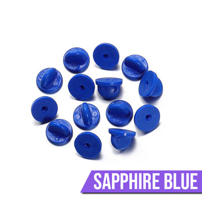 Loose Brooch Pin Backs - A pile of rubber brooch backs in sapphire blue.