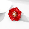 The Carmine Enamel Poppy Brooch - A vibrant, bright red round poppy brooch with sparkling crystals and a pearl in the centre.