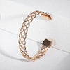 Celeste Woven Cuff Bracelet - A beautiful simple rose gold cuff that looks like plaited strands of wire.