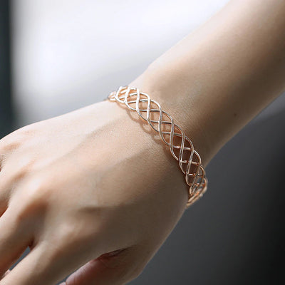 Celeste Woven Cuff Bracelet - A beautiful simple rose gold cuff that looks like plaited strands of wire.