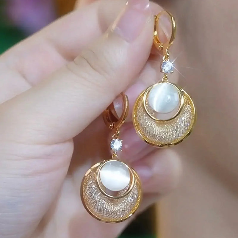 Charlotte Mesh Loop Drop Earrings - Sparkling circular drop earrings featuring interlocking rings of gold, opal, and crystal-filled metal mesh.