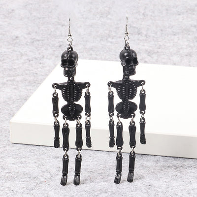 Charon Dancing Skeleton Earrings - Large acrylic resin skeleton earrings suspended from a basic french hook.