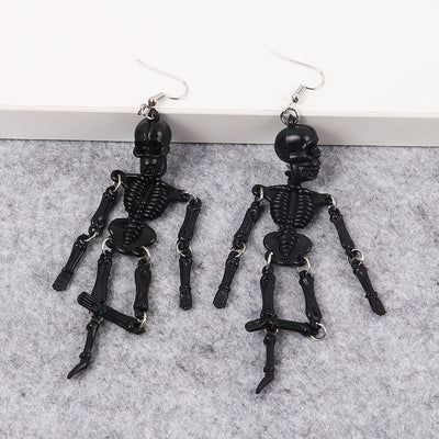 Charon Dancing Skeleton Earrings - Large acrylic resin skeleton earrings suspended from a basic french hook.