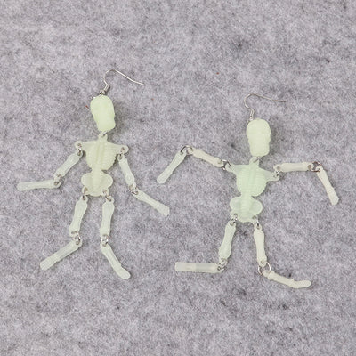 Charon Dancing Skeleton Earrings - Large acrylic resin skeleton earrings suspended from a basic french hook.