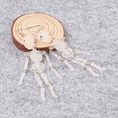 Charon Dancing Skeleton Earrings - Large acrylic resin skeleton earrings suspended from a basic french hook.