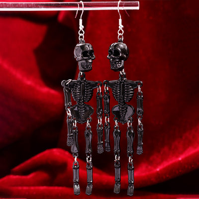 Charon Dancing Skeleton Earrings - Large acrylic resin skeleton earrings suspended from a basic french hook.