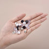 Cheeky Crafter Brooch Pins & Backs Kit - A box of 48 pin-style brooch backs and matching caps, shown in various uses.