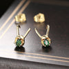 Cheeky Geek Trickster Transforming Stud Earrings - Teeny tiny green stud earrings, with a removable horned helmet to make them look like a miniature, stylised tribute to Loki, God of Mischief.