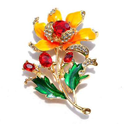 Citrika Orange Blossom Brooch - A detailed floral brooch featuring a large central stone with ruffled enamel petals surrounding it, and lots of colourful crystals to really make it pop.