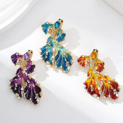 Cleo Double Tail Betta Fish Brooch - Three elegant stylised fish brooches adorned with tiny crystals and pearls, available in blue, orange, or purple colour palettes.