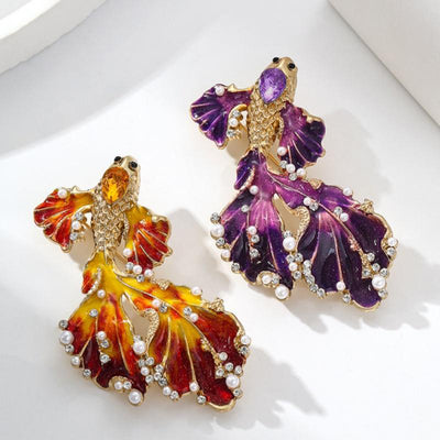 Cleo Double Tail Betta Fish Brooch - Three elegant stylised fish brooches adorned with tiny crystals and pearls, available in blue, orange, or purple colour palettes.