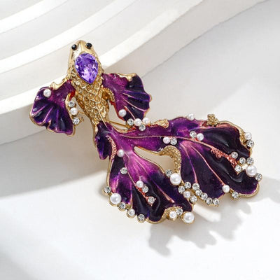 Cleo Double Tail Betta Fish Brooch - Three elegant stylised fish brooches adorned with tiny crystals and pearls, available in blue, orange, or purple colour palettes.
