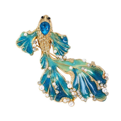 Cleo Double Tail Betta Fish Brooch - Three elegant stylised fish brooches adorned with tiny crystals and pearls, available in blue, orange, or purple colour palettes.