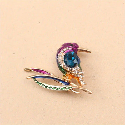 Cute Critters Brooch - Kingfisher - An adorable rainbow-coloured crystal and enamel brooch shaped like a bird sitting on a branch.