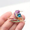 Cute Critters Brooch - Kingfisher - An adorable rainbow-coloured crystal and enamel brooch shaped like a bird sitting on a branch.