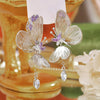 The Cynthia Butterfly Crystal Earrings - Sparkling silver butterfly wing earrings with purple and white crystals.