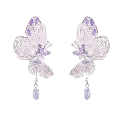 The Cynthia Butterfly Crystal Earrings - Sparkling silver butterfly wing earrings with purple and white crystals.