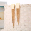 Dakari Tassel Earrings - Long stylish statement dangle earrings, featuring a solid rectangle over the lobe, with assorted long tassels strung off it.