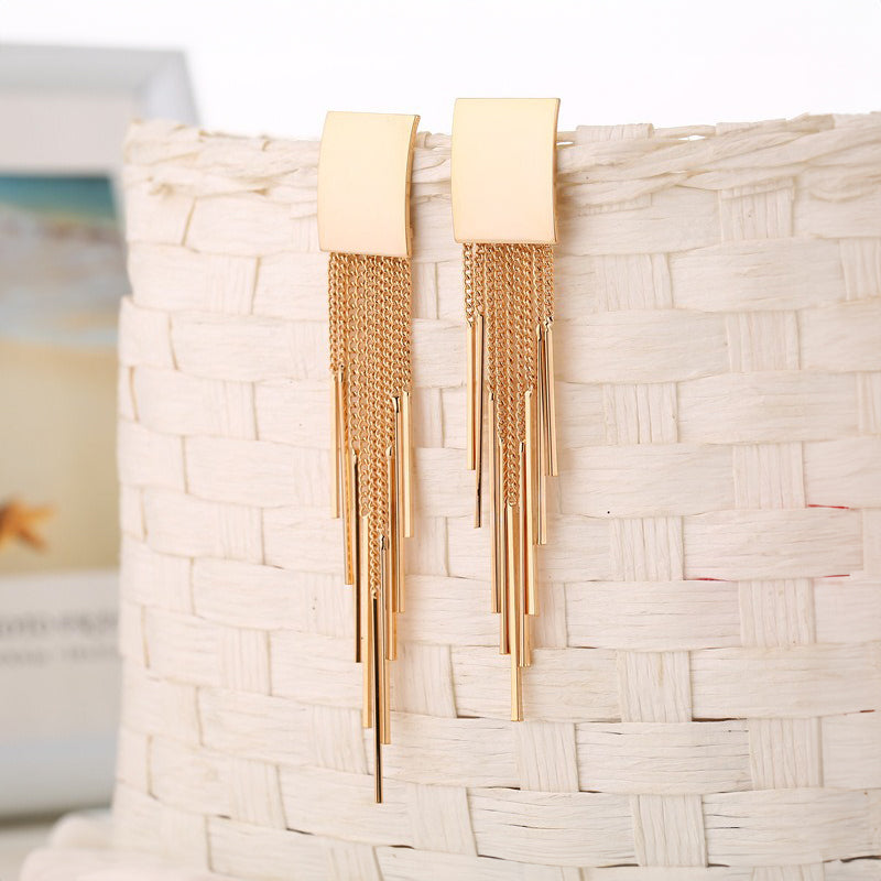 Dakari Tassel Earrings - Long stylish statement dangle earrings, featuring a solid rectangle over the lobe, with assorted long tassels strung off it.