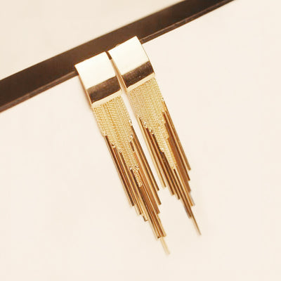 Dakari Tassel Earrings - Long stylish statement dangle earrings, featuring a solid rectangle over the lobe, with assorted long tassels strung off it.