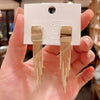 Dakari Tassel Earrings - Long stylish statement dangle earrings, featuring a solid rectangle over the lobe, with assorted long tassels strung off it.