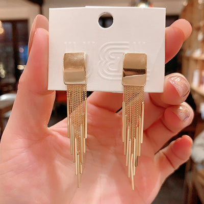 Dakari Tassel Earrings - Long stylish statement dangle earrings, featuring a solid rectangle over the lobe, with assorted long tassels strung off it.