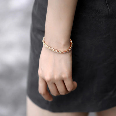 Damodice Spiral Chain Bracelet - A beautiful rose gold spiral chain bracelet that looks like it's made out of twisted strands of gold.