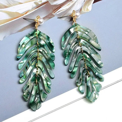 Daphne Acrylic Fern Frond Dangle Earrings - Large resin earrings made to resemble the fronds of a fern, formed from marbled acrylic in various shades of green, red, cream, yellow, and purple.