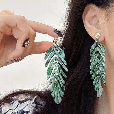 Daphne Acrylic Fern Frond Dangle Earrings - Large resin earrings made to resemble the fronds of a fern, formed from marbled acrylic in various shades of green, red, cream, yellow, and purple.