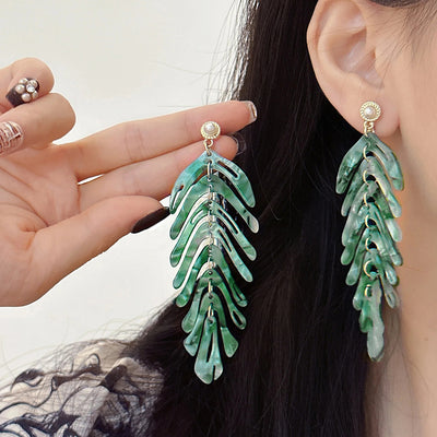 Daphne Acrylic Fern Frond Dangle Earrings - Large resin earrings made to resemble the fronds of a fern, formed from marbled acrylic in various shades of green, red, cream, yellow, and purple.