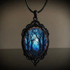 Dark Forest Cameo Necklace - A large gothic glass cabochon featuring an image of dark, spooky trees against a dark blue night sky background.