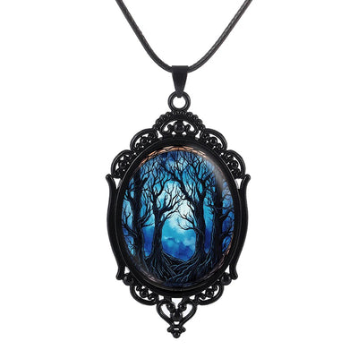 Dark Forest Cameo Necklace - A large gothic glass cabochon featuring an image of dark, spooky trees against a dark blue night sky background.