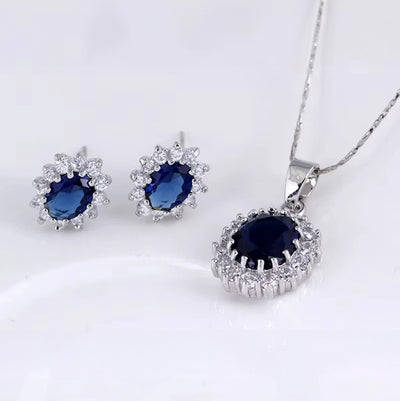 Diana II Luxury Crystal Jewellery Set - A beautiful large crystal surrounded by smaller white crystals. The central stone is available in bright blue, dark blue, green, purple, or red.
