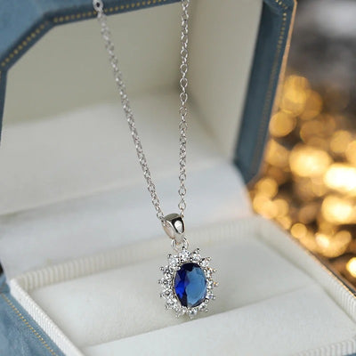 Diana II Luxury Crystal Jewellery Set - A beautiful large crystal surrounded by smaller white crystals. The central stone is available in bright blue, dark blue, green, purple, or red.