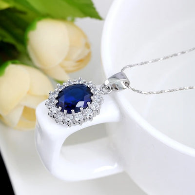 Diana II Luxury Crystal Jewellery Set - A beautiful large crystal surrounded by smaller white crystals. The central stone is available in bright blue, dark blue, green, purple, or red.