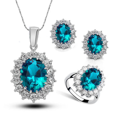 Diana II Luxury Crystal Jewellery Set - A beautiful large crystal surrounded by smaller white crystals. The central stone is available in bright blue, dark blue, green, purple, or red.