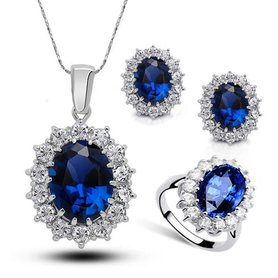 Diana II Luxury Crystal Jewellery Set - A beautiful large crystal surrounded by smaller white crystals. The central stone is available in bright blue, dark blue, green, purple, or red.
