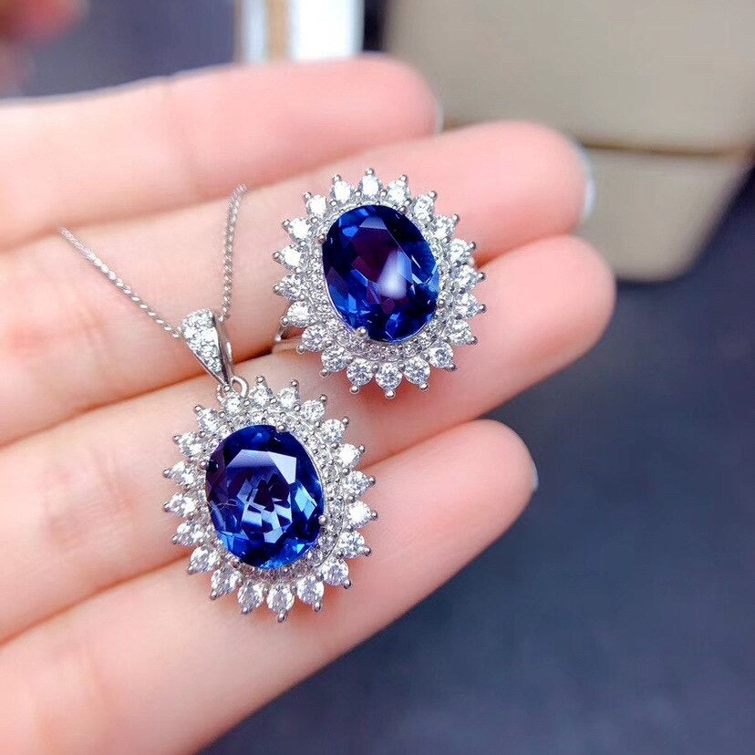 Diana Luxury Crystal Pendant & Ring Set - A beautiful large dark blue crystal nestled amongst approximately 40 smaller white quartz stones.
