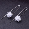 Elsa Crystal Drop Threader Earrings - A sparkling snowflake-style charm suspended on a long silver threader earring.