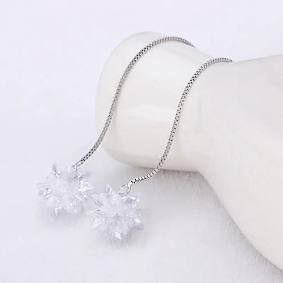 Elsa Crystal Drop Threader Earrings - A sparkling snowflake-style charm suspended on a long silver threader earring.