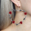 Elvira Barbed Wire Heart Drop Earrings - Large gothic earrings crafted from sculpted metal to resemble a heart-shape made of barbed wire and adorned with small flowers.