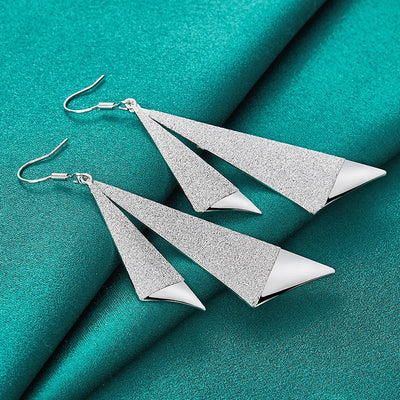 Emilie Geometric Drop Earrings - A pair of beautiful silver earrings made from a pair of cleverly-shaped and textured triangles that fall together to resemble the folds of fabric