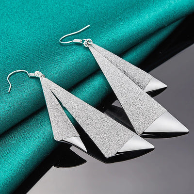 Emilie Geometric Drop Earrings - A pair of beautiful silver earrings made from a pair of cleverly-shaped and textured triangles that fall together to resemble the folds of fabric