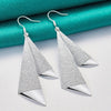 Emilie Geometric Drop Earrings - A pair of beautiful silver earrings made from a pair of cleverly-shaped and textured triangles that fall together to resemble the folds of fabric