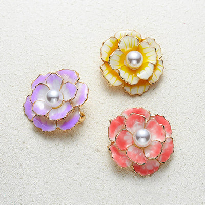 Emma II Ruffled Peony Enamel Brooch - A round, elegant brooch featuring an array of ruffled petals clustered around a small round pearl.