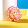 Emma II Ruffled Peony Enamel Brooch - A round, elegant brooch featuring an array of ruffled petals clustered around a small round pearl.