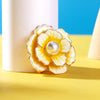 Emma II Ruffled Peony Enamel Brooch - A round, elegant brooch featuring an array of ruffled petals clustered around a small round pearl.