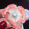 Emma II Ruffled Peony Enamel Brooch - A round, elegant brooch featuring an array of ruffled petals clustered around a small round pearl.
