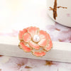 Emma II Ruffled Peony Enamel Brooch - A round, elegant brooch featuring an array of ruffled petals clustered around a small round pearl.