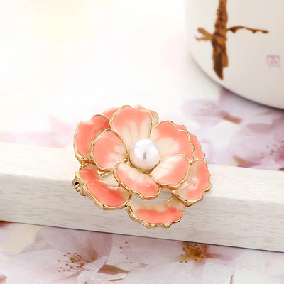 Emma II Ruffled Peony Enamel Brooch - A round, elegant brooch featuring an array of ruffled petals clustered around a small round pearl.